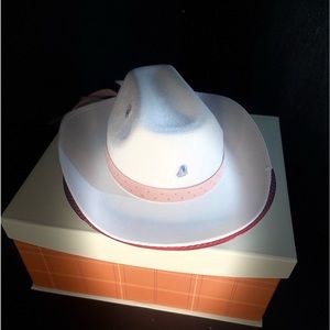 White Cowgirl hat with pink ribbon around brim